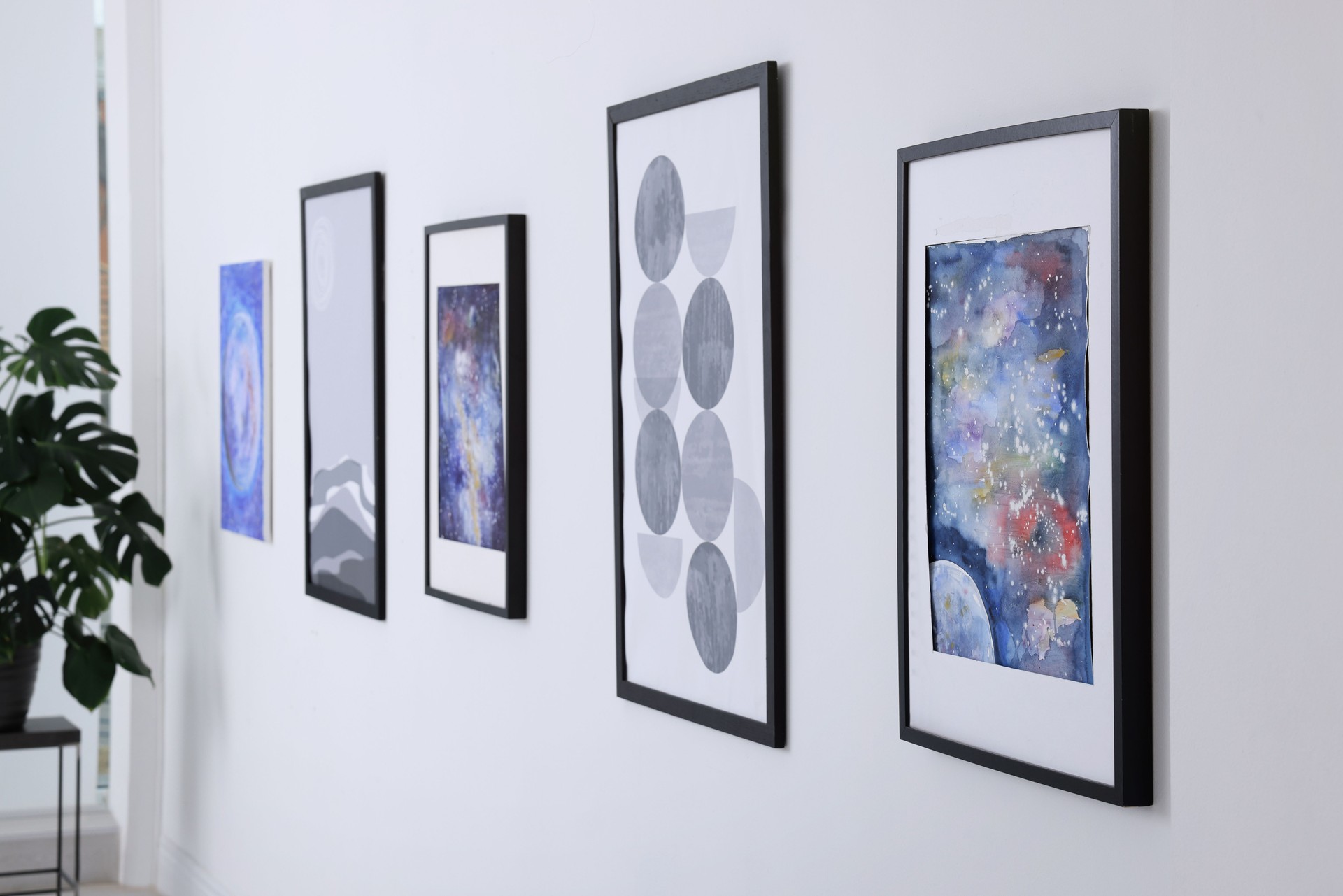 Beautiful paintings on wall in modern art gallery